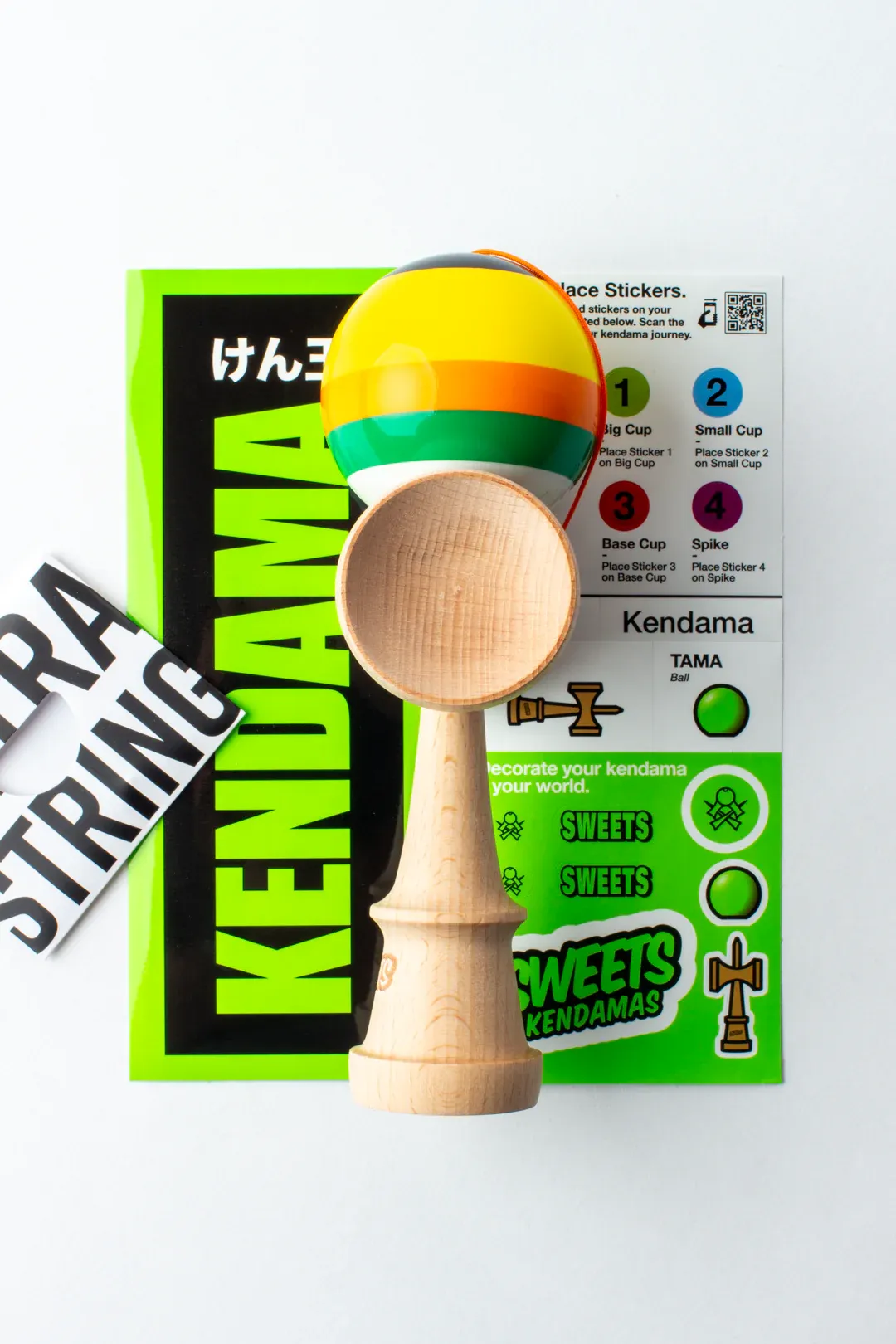 Cumpara Sweets Kendama Classic 5 Stripe Poncho Sweets <p>Incearca si tu noile kendame Sweets: Prime 5 Stripes!</p><p>Cele 4 modele noi de la Sweets vin cu un design fresh si cu o constructie ideala pentru trikc-urile de echilibru!</p><p>Tama, vopsita in laboratoarele Sweets cu Prime Tacky, se remarca prin cele 5 dungi de culori diferite, care marcheaza gaura, pentru ca tu sa o poti urmari mai usor in miscare.</p><p>Noua Prime Poncho este o kendama formidabila pentru a porni o competitie interesanta si fascinanta, fara prea multe pregatiri.</p><p>Ia-ti Kendama Prime 5 Stripes - Poncho si scoate-o la o intrecere cu ceilalti! </p><p>La fiecare Sweets Kendama Prime - 5 Stripes comandata, vei primi stickere, 1 manual de instructiuni, ata si margica de rezerva. </p>. Kendama originala din lemn, ideala pentru freestyle, antrenament si competitie. Potrivita pentru incepatori si avansati. [2]