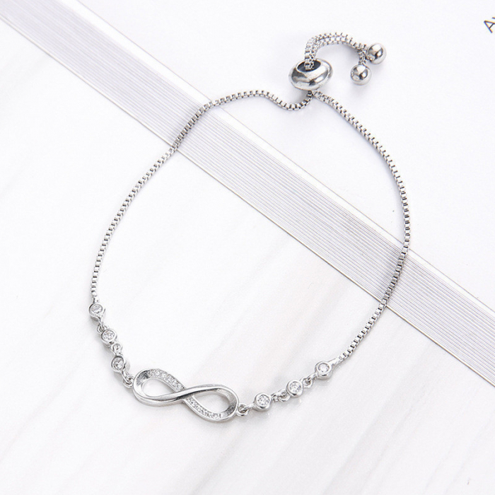 Bratara de dama finuta, model reglabi cu charm in forma de semnul infinitului, pietre zirconiu, placat cu aur 18K, marime reglabila, Tessero, argintiu [1]