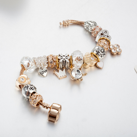 Bratara de dama cu 18 charm-uri diferite modele, model cu coroana, placat cu aur 18K, inchidere clips, marime 18 cm, lant de siguranta, Tessero, auriu [1]